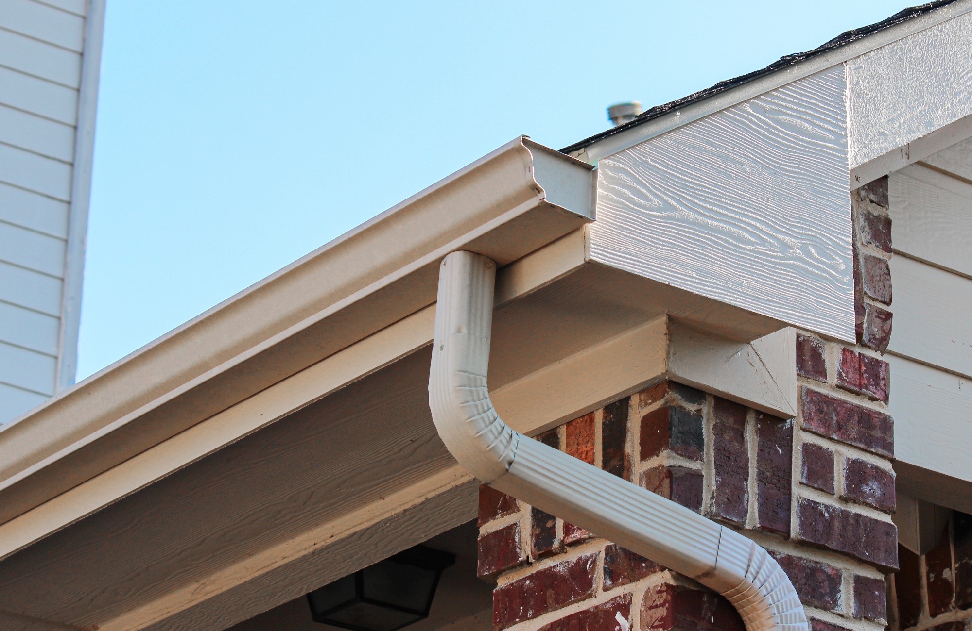 Gutters installed by QRHI on a brick home